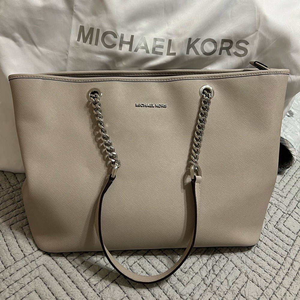 Michael Kors purse in Cement. It is a grey color with chain handles